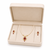 Pearl strand necklace and earring set with ruby pendant gold-tone setting, oval ruby centerpiece, drop earrings included
