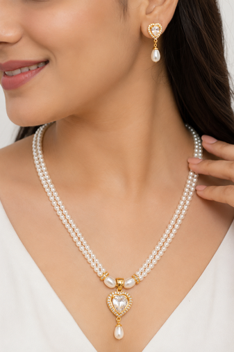 Pearl double strand necklace and earrings set with cz heart pendant gold-tone setting, drop earrings, cz stone accent.