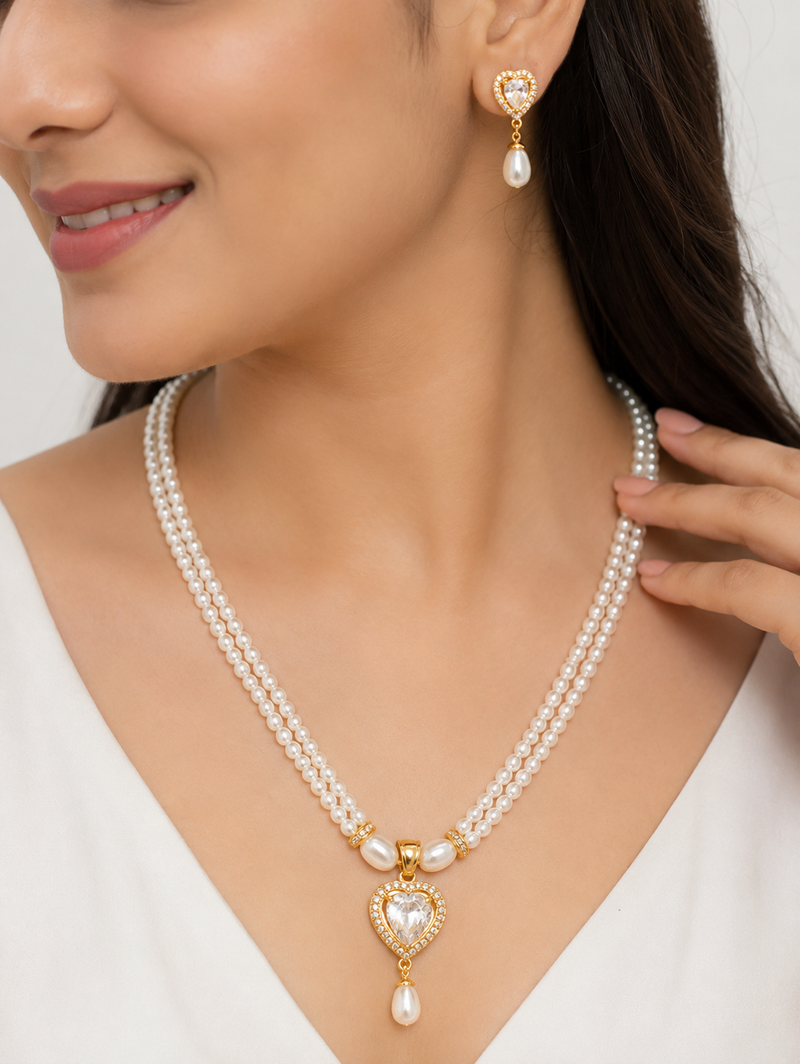 Pearl double strand necklace and earrings set with cz heart pendant gold-tone setting, drop earrings, cz stone accent.