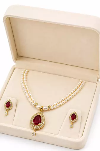 Double strand pearl necklace set with ruby teardrop pendant matching earrings included, gold-tone setting, cz studded.