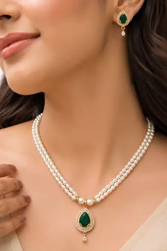 Pearl double strand necklace set with emerald green pendant matching earrings included, teardrop cz pendant, gold-tone.