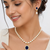 Pearl necklace & earring set with blue sapphire pendant gold-tone accents, cz baguette surround, drop earrings included