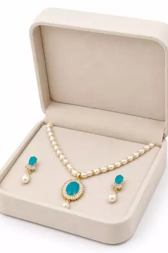 Pearl necklace and earring set with turquoise pendant cz baguette accents, gold-tone spacers, drop pearl earrings.