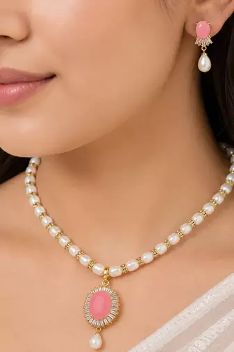 Pearl necklace and earring set with pink stone pendant cz baguette accents, gold-tone finish, drop earrings included.