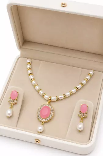Pearl necklace and earring set with pink stone pendant cz baguette accents, gold-tone finish, drop earrings included.