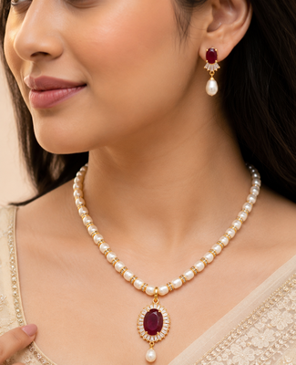 Pearl necklace and earring set with ruby pendant cz baguette accents, gold-tone spacers, drop earrings included. 1
