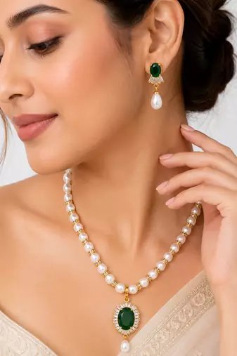 Pearl beaded necklace & earring set with emerald green pendant gold-tone accents, cz baguette halo, drop pearl earrings.