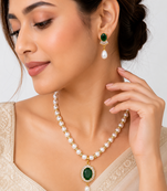 Pearl beaded necklace & earring set with emerald green pendant gold-tone accents, cz baguette halo, drop pearl earrings.
