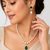 Pearl beaded necklace & earring set with emerald green pendant gold-tone accents, cz baguette halo, drop pearl earrings.