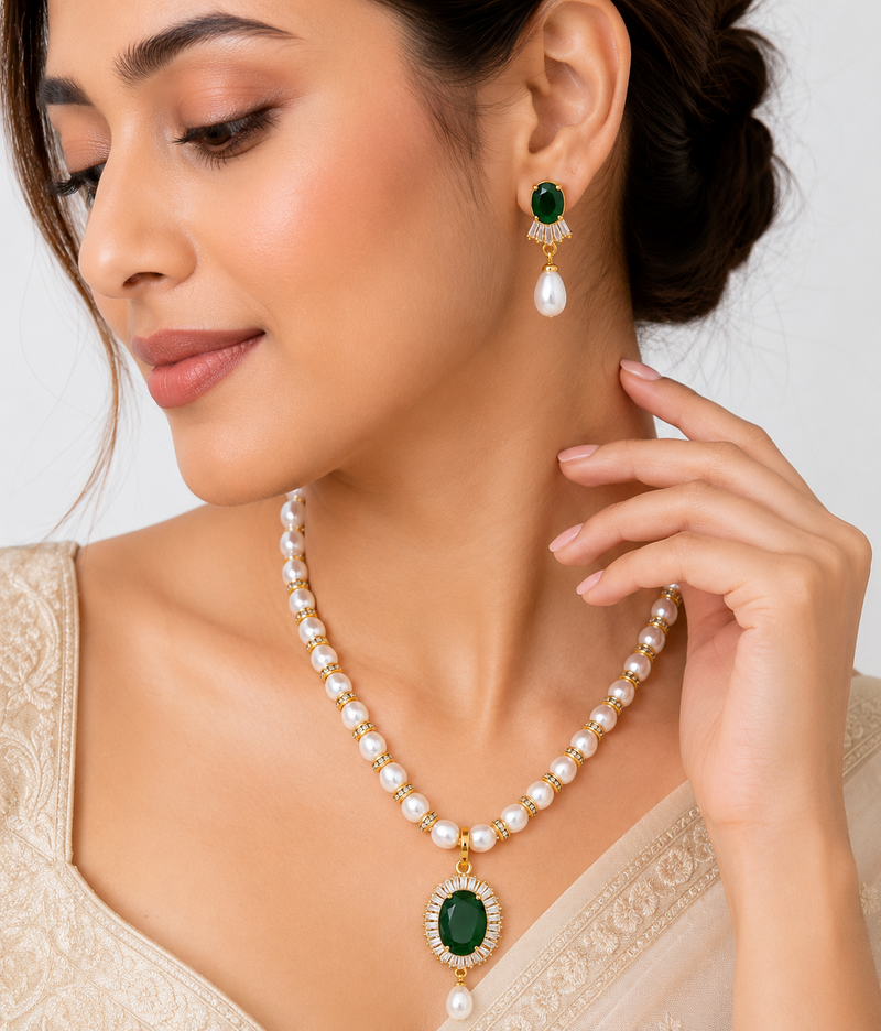 Pearl beaded necklace & earring set with emerald green pendant gold-tone accents, cz baguette halo, drop pearl earrings.