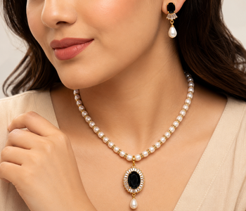 Pearl beaded necklace & earring set with black oval pendant gold-tone accents, cz baguette halo, drop earrings included. 1