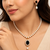 Pearl beaded necklace & earring set with black oval pendant gold-tone accents, cz baguette halo, drop earrings included.