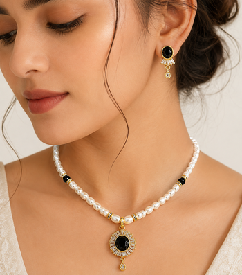 Pearl beaded necklace and earrings set with black stone pendant gold-tone finish, cz baguette accents, drop earrings. 1