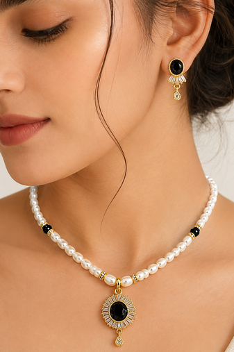 Pearl beaded necklace and earrings set with black stone pendant gold-tone finish, cz baguette accents, drop earrings.