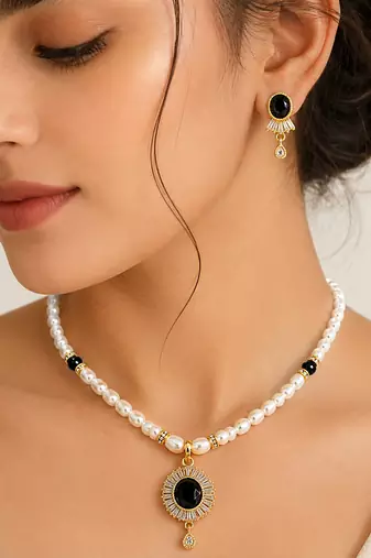 Pearl beaded necklace and earrings set with black stone pendant gold-tone finish, cz baguette accents, drop earrings.