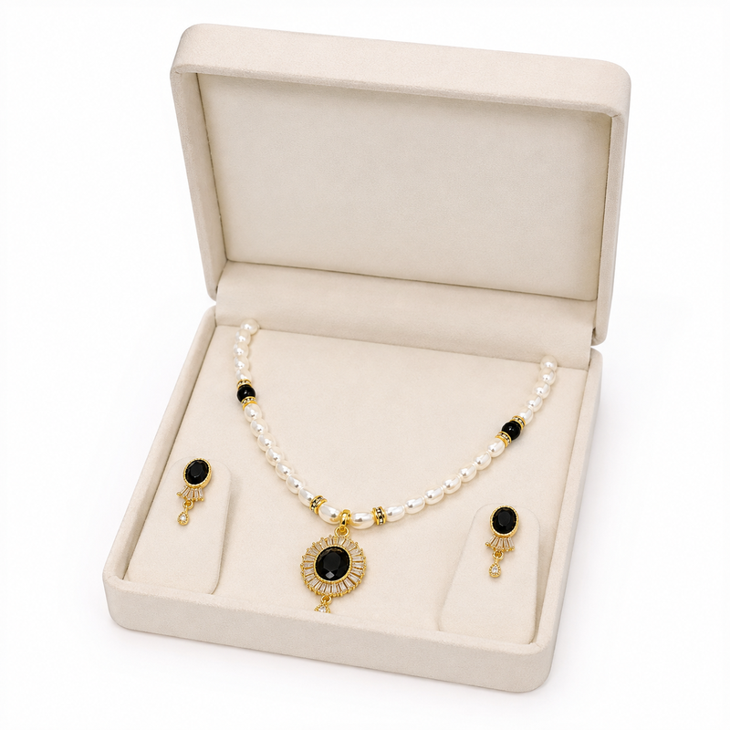 Pearl beaded necklace and earrings set with black stone pendant gold-tone finish, cz baguette accents, drop earrings.