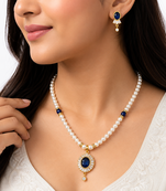 Pearl necklace and earring set with blue sapphire pendant gold-tone finish, cz baguette halo, blue stone accents.