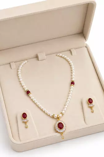 Pearl necklace and earrings set with ruby pendant, gold tone freshwater pearls, cz baguette halo, matching earrings.