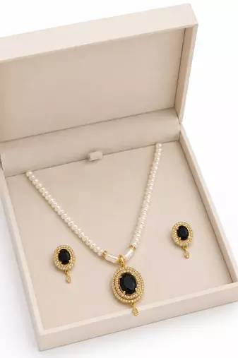 Pearl strand necklace set with black oval pendant and earrings cz stone accents, gold-tone setting, matching earrings.