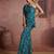 Teal floral one-shoulder peplum top and pants set