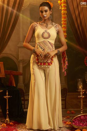 Cream georgette embroidered top with mirror, thread, tassels, shells and palazzo set