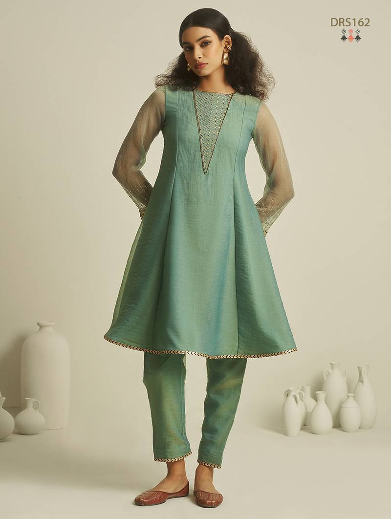 Sea green chiffon kurta set with sheer sleeves and hand embellished detailing