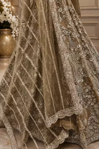 Beige color Shimmering silver-gold sequins Dori embroidery Fine cut-dana work net Lehenga Choli set