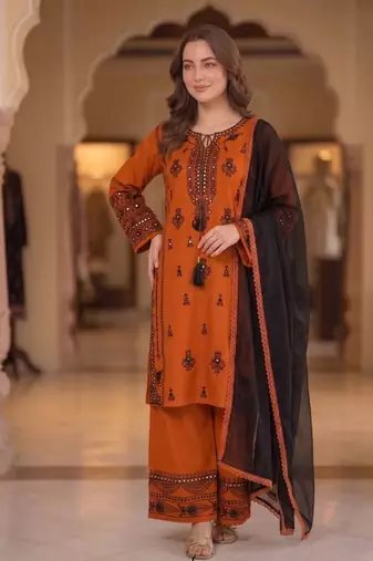 orange color embroidery and mirror work rayon salwar suit