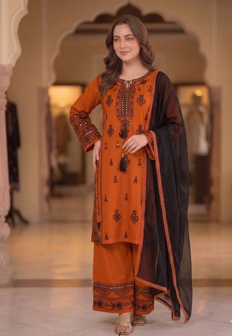 orange color embroidery and mirror work rayon salwar suit