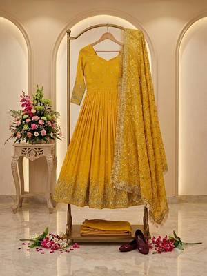 yellow color hevvy sequins emrodery work faux georgette gown set 2
