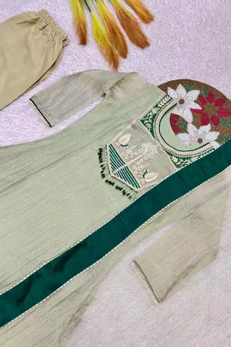 sea green color embroidery and thread work with hand stitched beads and latkan work silk blend kurti set
