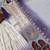 Purple And White Color Embroidery And Thread Work Georgette Salwar Suit