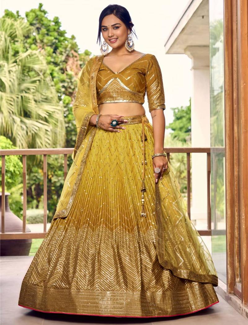 dark yellow silk blend embroidered traditional lehenga choli with free size upto 42