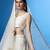 cream silk blend embroidered traditional lehenga choli with free size upto 42
