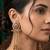 Women gold-toned & pink antique kashmiri floral stud earrings with ghungroo drop tassels