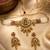 Women gold-plated kundan & pearl studded multi-strand choker jewellery set