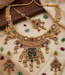 Women gold-toned & green temple antique jewellery set with maang tikka