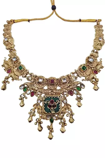 Women gold-toned & green temple antique jewellery set with maang tikka