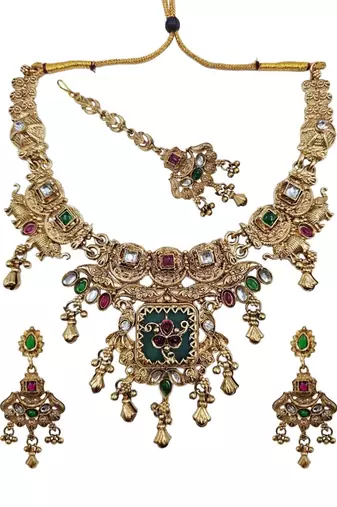 Women gold-toned & green temple antique jewellery set with maang tikka