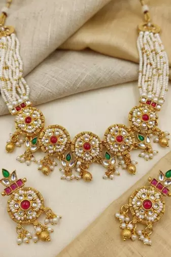 Women gold-plated kundan & multi-strand pearl jewellery set