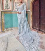 Graceful sky blue  georgette embroidery work saree