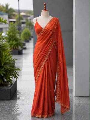 Orange satin sequins work embroidered saree 1