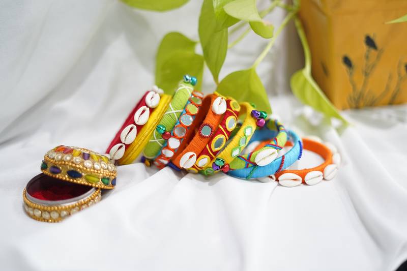  handcrafted multicolour boho thread bangle set with cowrie shells & mirrors