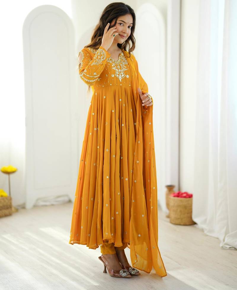 Dark-yellow faux georgette embroidered flared gown set