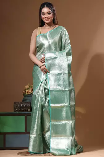 green silk blend saree with blouse piece