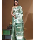 green silk blend saree with blouse piece