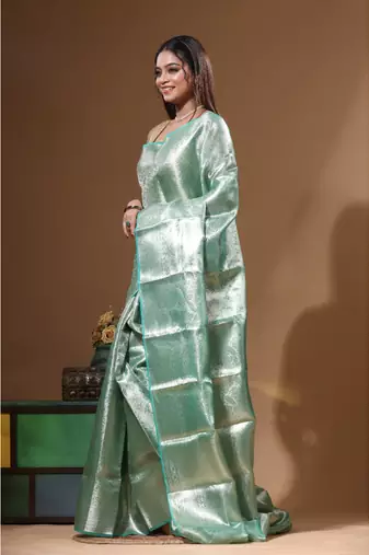 green silk blend saree with blouse piece