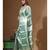green silk blend saree with blouse piece
