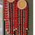 handmade red pom pom beads hanging with golden bells decorative wall hanging for home decoration (pack of 2)