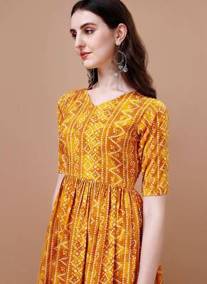 YELLOW BANDHANI FOLI PRINT DESIGN WORK WITH RAYON FABRIC KURTI  2